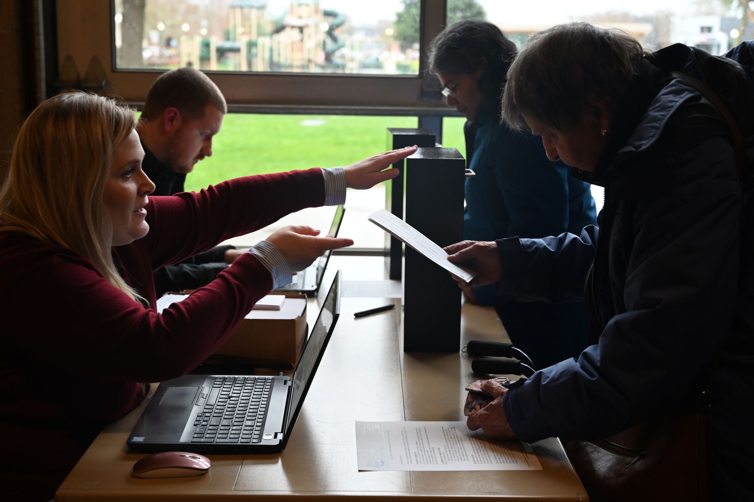 Voters submitting ballots during the 2024 Board of Supervisors election.